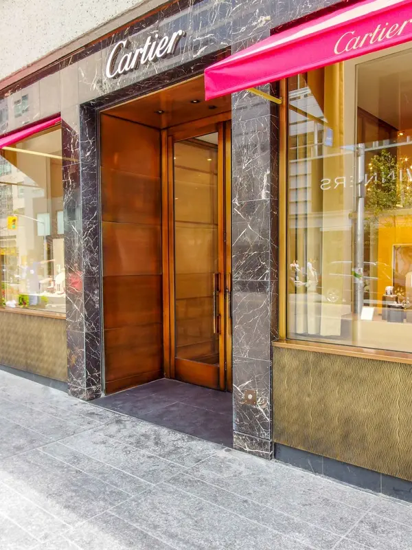 Elegant Cartier store entrance with marble facade