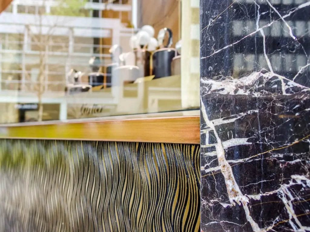 Marble panel beside window display of coffee shop