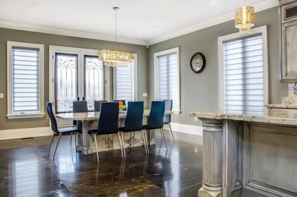Elegant dining room with marble table and blue chairs