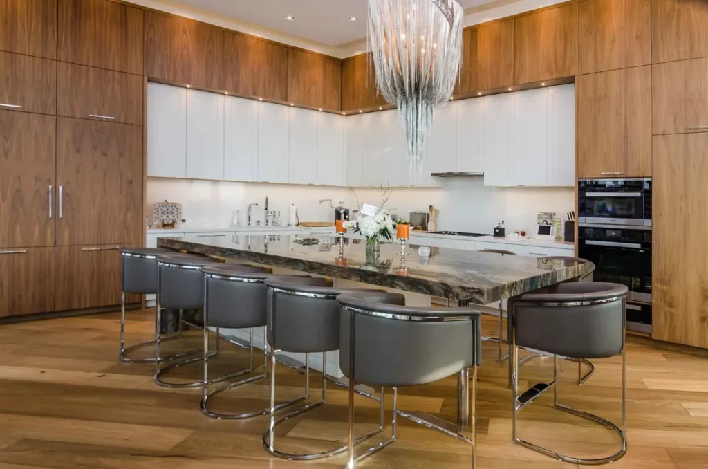 Modern kitchen with wooden cabinets and marble island